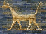 The Ishtar Gate (Persian: دروازه ایشتار‎)(Arabic: بوابة عشتار‎) was the eighth gate to the inner city of Babylon. It was constructed in about 575 BC by order of King Nebuchadnezzar II on the north side of the city.<br/><br/>

Dedicated to the Babylonian goddess Ishtar, the gate was constructed using glazed brick with alternating rows of bas-relief mušḫuššu (dragons) and aurochs.<br/><br/>

The roof and doors of the gate were of cedar, according to the dedication plaque. Through the gate ran the Processional Way, which was lined with walls covered in lions on glazed bricks (about 120 of them). Ishtar Gate has only gods and goddesses which include Ishtar Adad and Marduk. Statues of the deities were paraded through the gate and down the Processional Way each year during the New Year's celebration.<br/><br/>

Originally the gate, being part of the Walls of Babylon, was considered one of the Seven Wonders of the world until it was replaced by the Lighthouse of Alexandria; in the 3rd century BC.